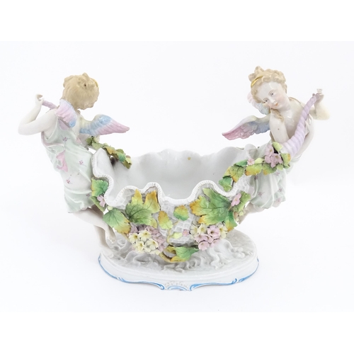 260 - A German porcelain centrepiece dish with cherub / putti and cornucopia detail. Marked under. Approx.... 