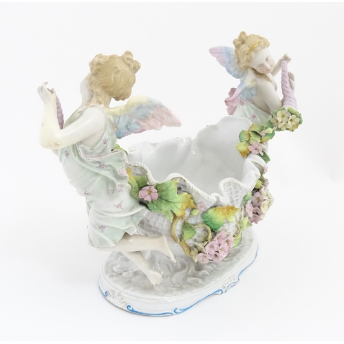 260 - A German porcelain centrepiece dish with cherub / putti and cornucopia detail. Marked under. Approx.... 