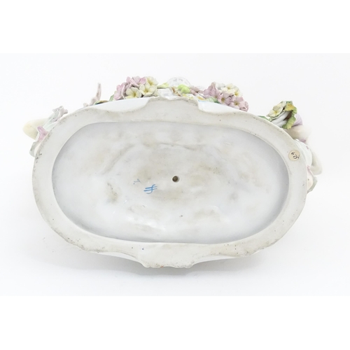 260 - A German porcelain centrepiece dish with cherub / putti and cornucopia detail. Marked under. Approx.... 