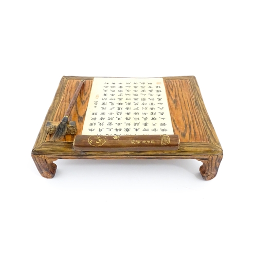 42 - A Chinese ceramic stand modelled as a tea table with Character script detail. Character marks under.... 