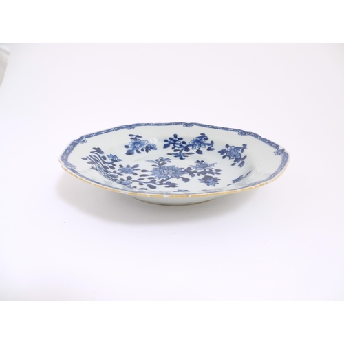 52 - A Chinese blue and white dish with floral and foliate decoration. Approx. 8 3/4