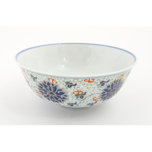 53 - A Chinese bowl decorated with scrolling floral and foliate detail. Character marks under. Approx. 3