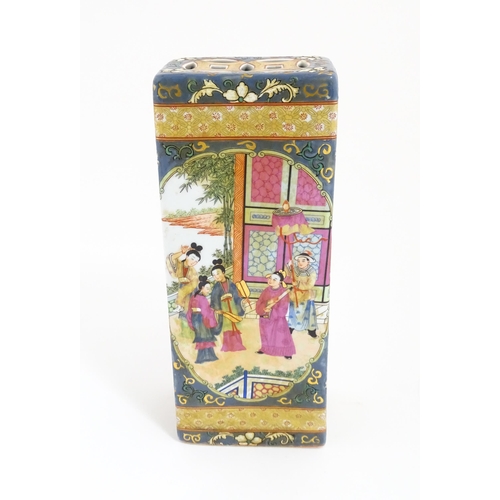 60 - A Chinese vase with twin elephant mask and ring handles decorated with figures with fans on a garden... 