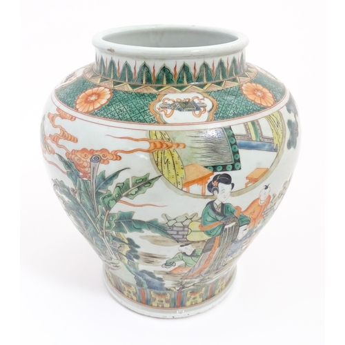 63 - A Chinese famille verte vase / jar decorated with children playing with lanterns etc. on a terrace, ... 