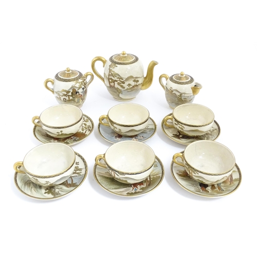 69 - A Japanese Satsuma tea set comprising tea pot, milk jug, twin handled sugar bowl, with six cups and ... 