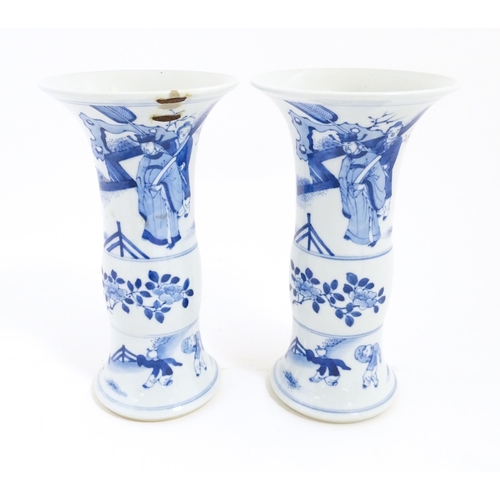 7 - A pair of Chinese blue and white vases with flared rims, decorated with figures on a terrace with ba... 