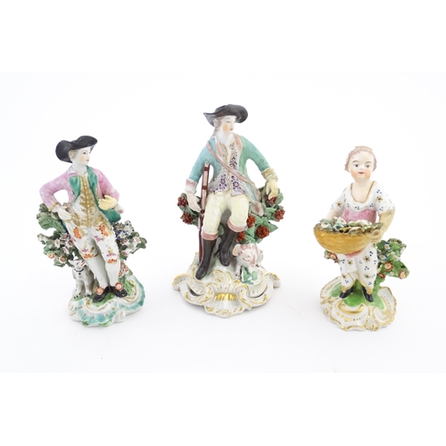 85 - Three ceramic figures comprising a Derby style model of a child holding a basket of flowers, a seate... 