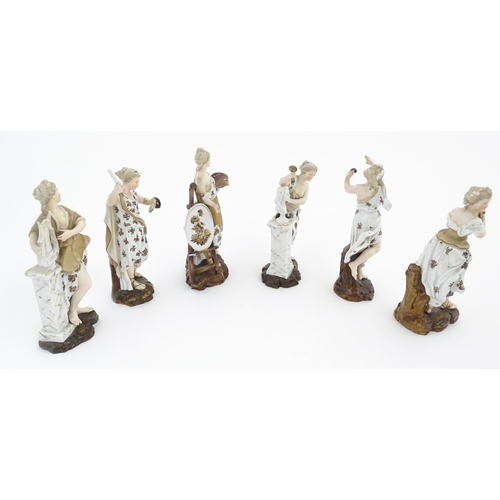 89 - A set of six porcelain figures of Muses personifying the Arts, each holding various attributes, to i... 