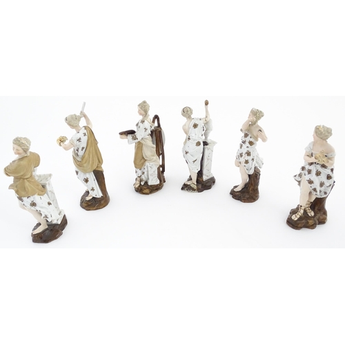 89 - A set of six porcelain figures of Muses personifying the Arts, each holding various attributes, to i... 