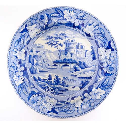 99 - A Minton blue and white plate in the Italian Ruins pattern. Marked under. Approx. 10