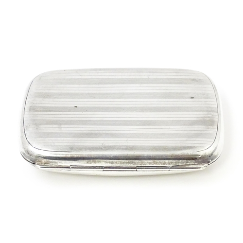 386 - A silver cigarette case with banded engine turned decoration hallmarked Birmingham 1927, maker Henry... 