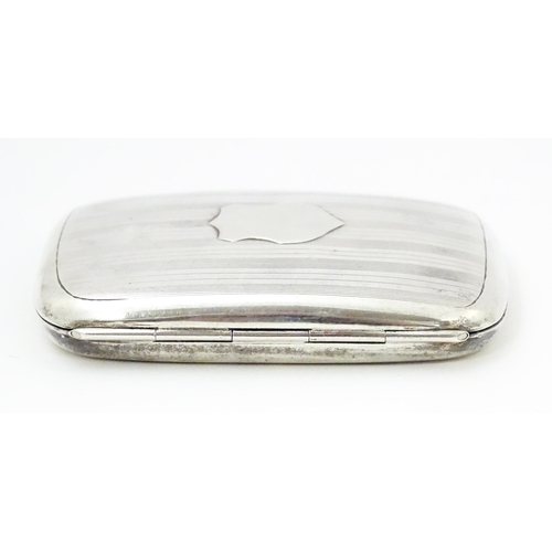 386 - A silver cigarette case with banded engine turned decoration hallmarked Birmingham 1927, maker Henry... 