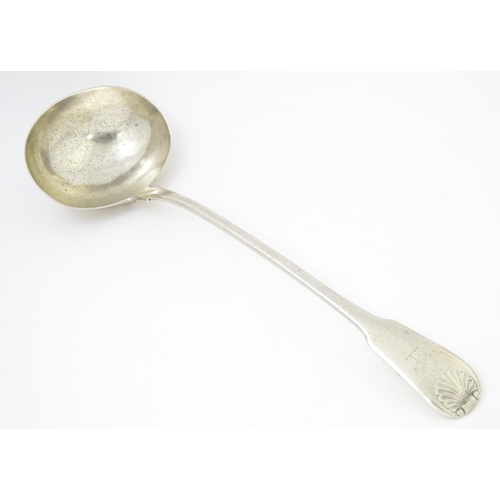 566 - A William IV Irish silver Fiddle & Shell pattern ladle hallmarked Dublin 1834, maker Philip Weekes. ... 