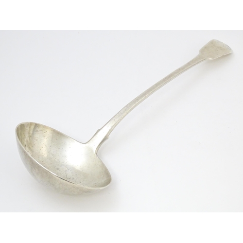 566 - A William IV Irish silver Fiddle & Shell pattern ladle hallmarked Dublin 1834, maker Philip Weekes. ... 