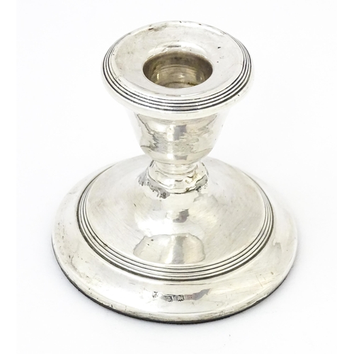 567 - A squat silver candlestick hallmarked Birmingham 1918, Williams (Birmingham) Ltd. Approx. 3