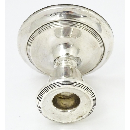 567 - A squat silver candlestick hallmarked Birmingham 1918, Williams (Birmingham) Ltd. Approx. 3