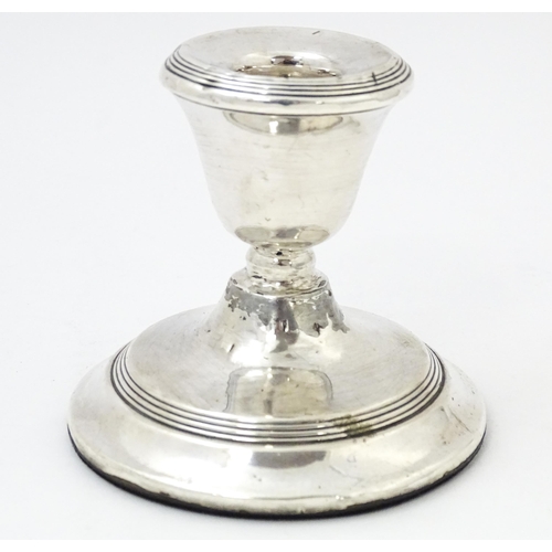 567 - A squat silver candlestick hallmarked Birmingham 1918, Williams (Birmingham) Ltd. Approx. 3