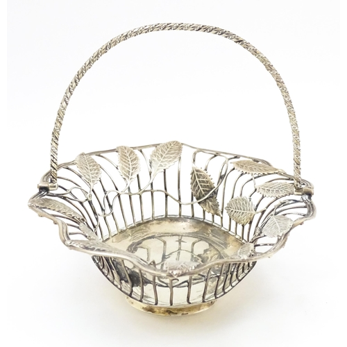 569 - A Geo III silver bon bon dish / sweetmeat basket with leaf detail, hallmarked London c. 1764. Approx... 