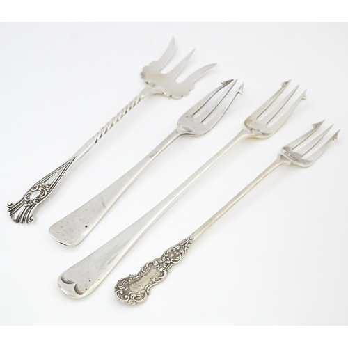 572 - Four assorted silver forks to include three pickle forks, hallmarks to include Birmingham 1901, Shef... 