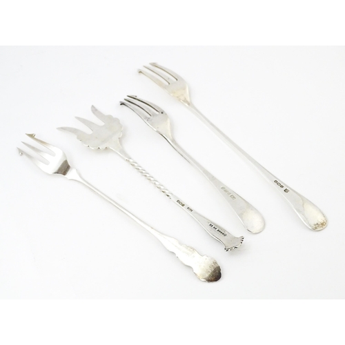 572 - Four assorted silver forks to include three pickle forks, hallmarks to include Birmingham 1901, Shef... 