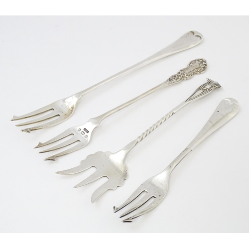 572 - Four assorted silver forks to include three pickle forks, hallmarks to include Birmingham 1901, Shef... 