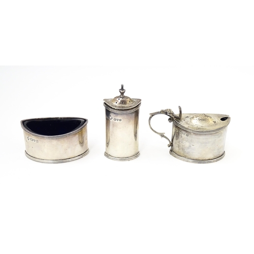 573 - A silver three piece cruet comprising salt, pepper and mustard pot, hallmarked Chester 1924/25 maker... 