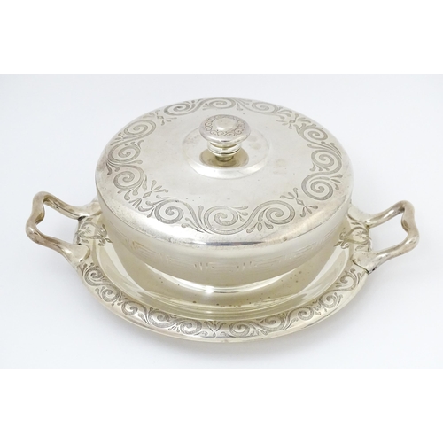 582 - A Victorian butter dish formed from a glass bowl with Greek Key decoration with a twin handled silve... 