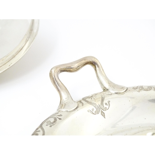 582 - A Victorian butter dish formed from a glass bowl with Greek Key decoration with a twin handled silve... 