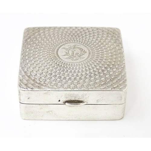 598 - A silver box / compact of squared form with engine turned decoration and gilded interior, hallmarked... 