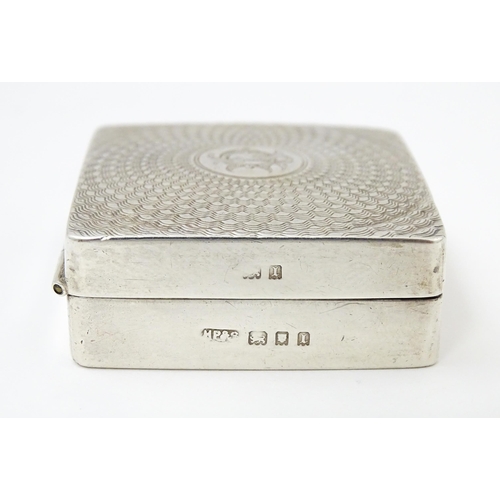 598 - A silver box / compact of squared form with engine turned decoration and gilded interior, hallmarked... 