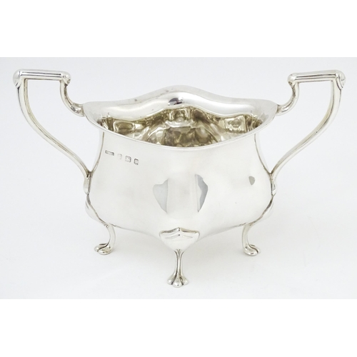 600 - An Art Nouveau silver twin handled sugar bowl, hallmarked Birmingham 1908, maker E. S Barnsley & Co.... 