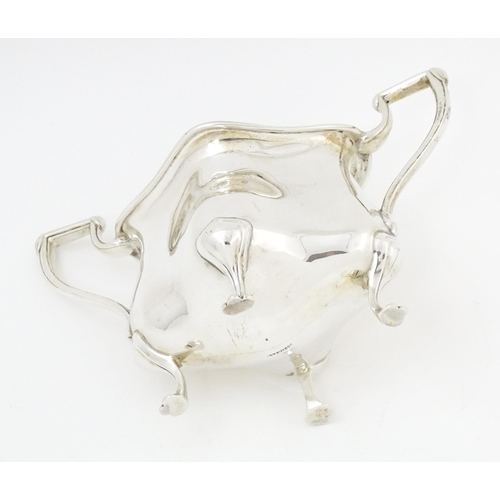 600 - An Art Nouveau silver twin handled sugar bowl, hallmarked Birmingham 1908, maker E. S Barnsley & Co.... 