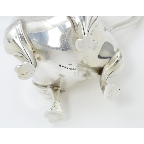 601 - An Art Nouveau silver cream jug hallmarked Birmingham 1908, maker E. S Barnsley & Co. Approx. 4 1/4