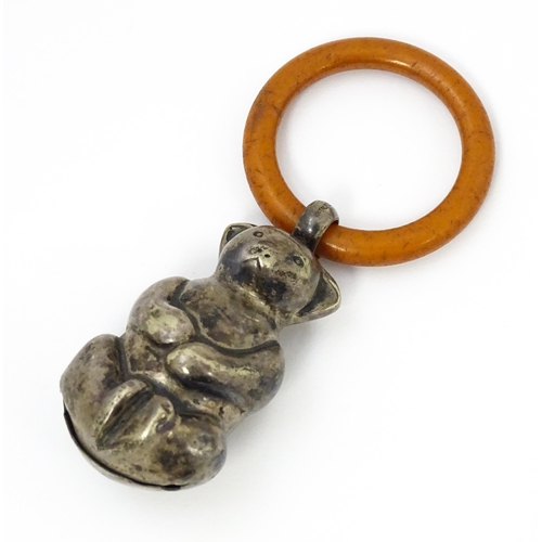 602 - A silver plate child's rattle of teddy bear form with teething ring. Bear approx. 2 1/2