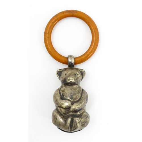 602 - A silver plate child's rattle of teddy bear form with teething ring. Bear approx. 2 1/2