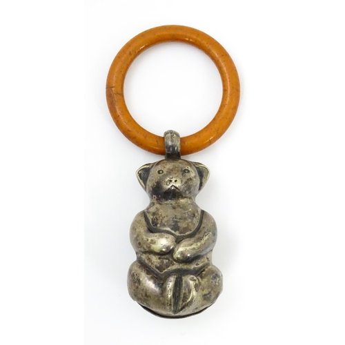 602 - A silver plate child's rattle of teddy bear form with teething ring. Bear approx. 2 1/2