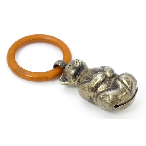 602 - A silver plate child's rattle of teddy bear form with teething ring. Bear approx. 2 1/2