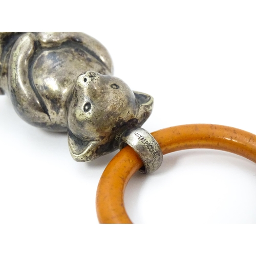 602 - A silver plate child's rattle of teddy bear form with teething ring. Bear approx. 2 1/2