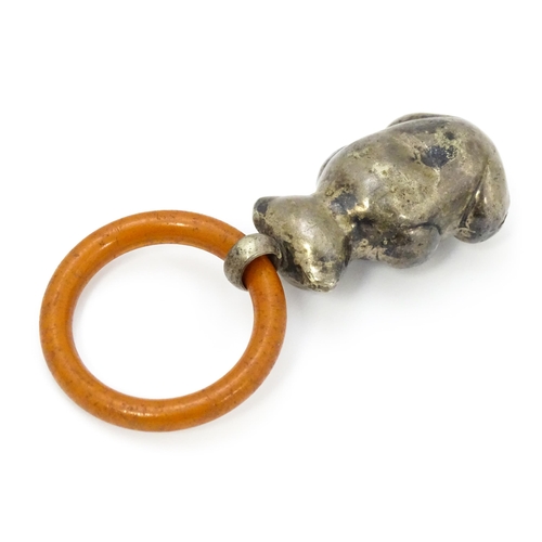 602 - A silver plate child's rattle of teddy bear form with teething ring. Bear approx. 2 1/2