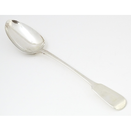 609 - A William IV silver Fiddle pattern basting / stuffing spoon hallmarked London 1832, maker Robert Hen... 