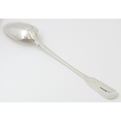 609 - A William IV silver Fiddle pattern basting / stuffing spoon hallmarked London 1832, maker Robert Hen... 