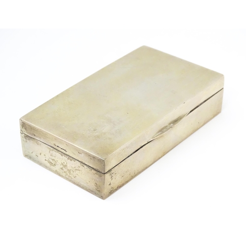 610 - Scandinavian silver: A .830 silver cigarette box stamped HG. Approx. 5