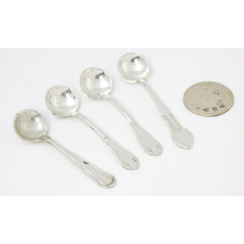 611 - Four various silver / white metal / silver plate salt spoons to include a Danish silver example date... 