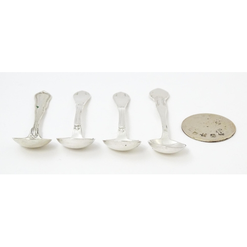 611 - Four various silver / white metal / silver plate salt spoons to include a Danish silver example date... 