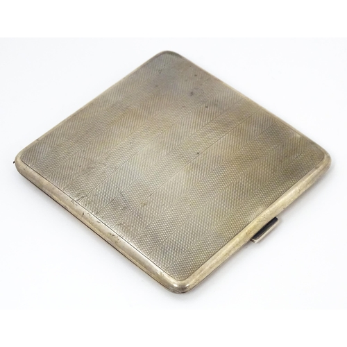 620 - An Art Deco silver cigarette case with engine turned decoration hallmarked Birmingham 1929, maker Ma... 