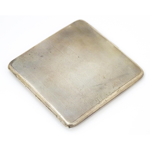 620 - An Art Deco silver cigarette case with engine turned decoration hallmarked Birmingham 1929, maker Ma... 