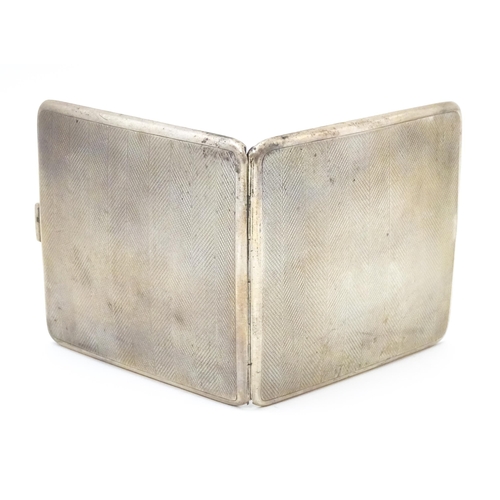 620 - An Art Deco silver cigarette case with engine turned decoration hallmarked Birmingham 1929, maker Ma... 