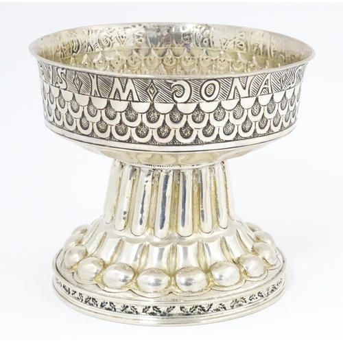 629 - A silver replica of the Tudor cup (Holms cup) of font shape with raised and chased repousse circular... 