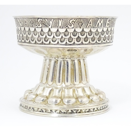 629 - A silver replica of the Tudor cup (Holms cup) of font shape with raised and chased repousse circular... 