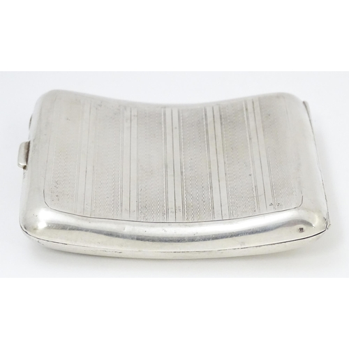 635 - An Art Deco silver cigarette case of shaped form with banded engine turned decoration, Birmingham 19... 